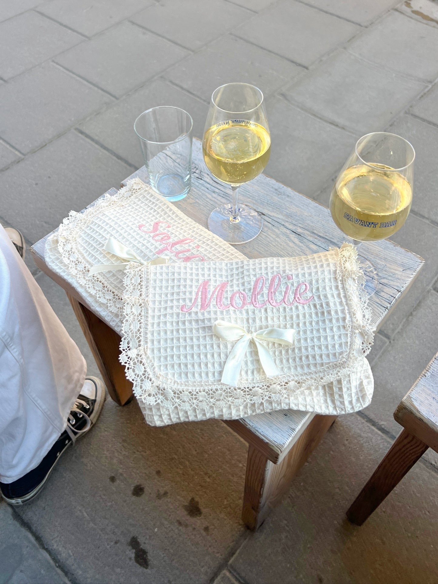 matching personalized embroidered makeup bag with bestfriend at a winebar.