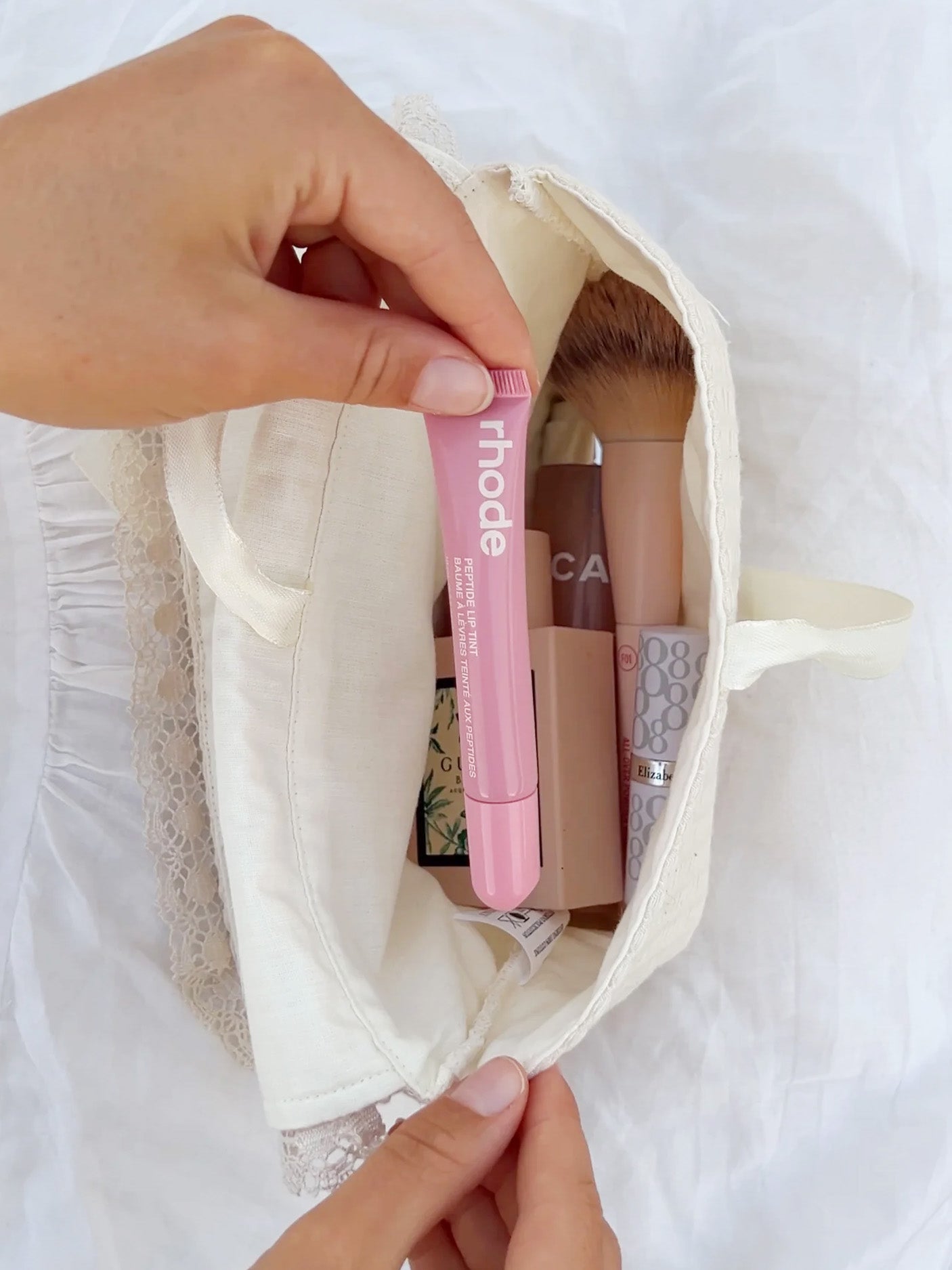 inside our personalized quilted makeup bag in soft cotton. embroidered with name in red
